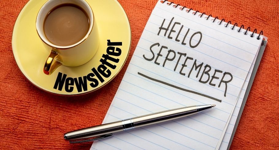 Hello September on notepad with Newsletter on coffee cup